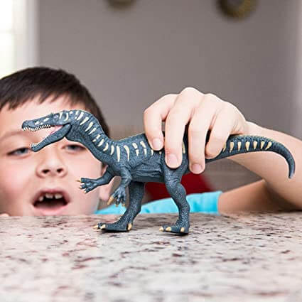 child enjoying with Dinosaur toy  - SCHLEICH BARYONYX